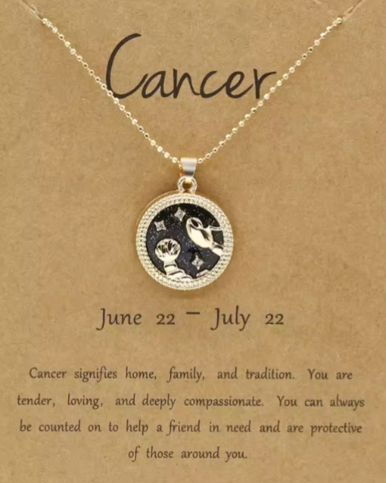 Necklace with zodiac sign pendant on a brown card with text.