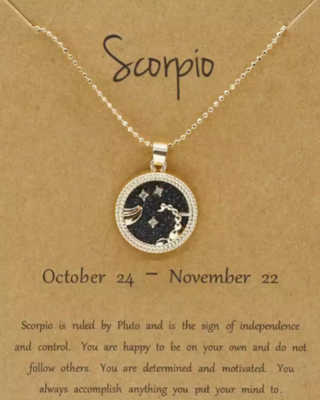 Scorpio zodiac necklace on a brown card with descriptive text.