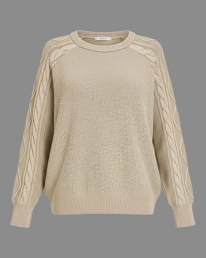 A beige crewneck knit sweater with textured cable detailing down the sleeves, shown against a solid gray background.