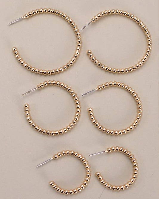 3 pairs of gold ball hoops in small, medium and large sizes. 