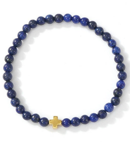 Blue beaded bracelet with a gold cross on a white background