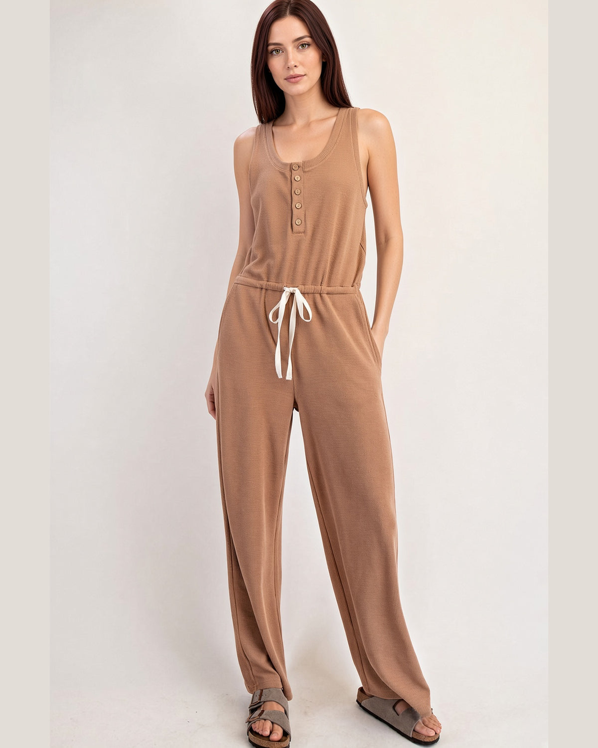 Cocoa sleeveless henley jumpsuit with drawstring waist and straight legs