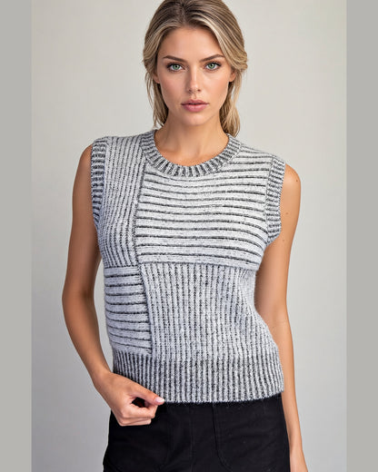 Charcoal and ivory mixed knit sleeveless sweater vest with crew neckline and cropped length.