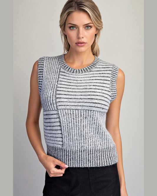 Charcoal and ivory mixed knit sleeveless sweater vest with crew neckline and cropped length.