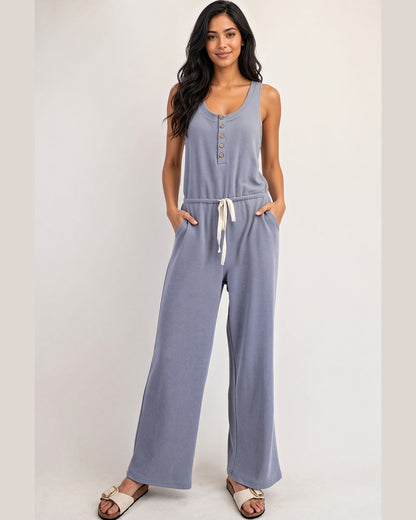 Soft blue sleeveless henley jumpsuit with drawstring waist and straight legs