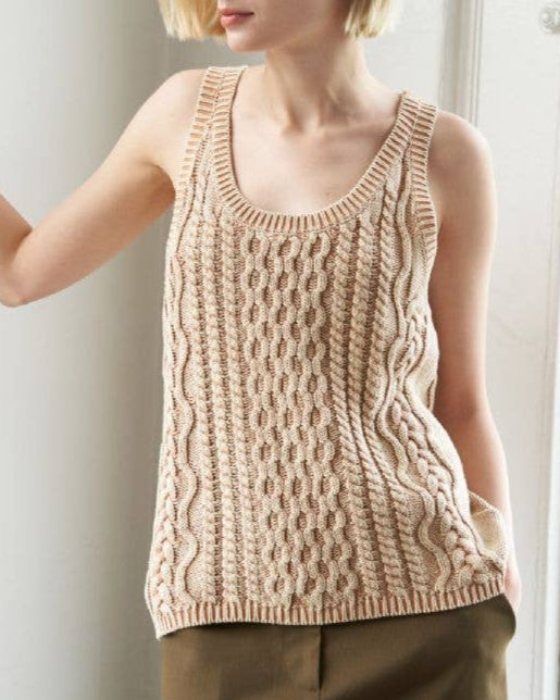 Washed camel colored cable knit tank top with U neckline and sleeveless cut.