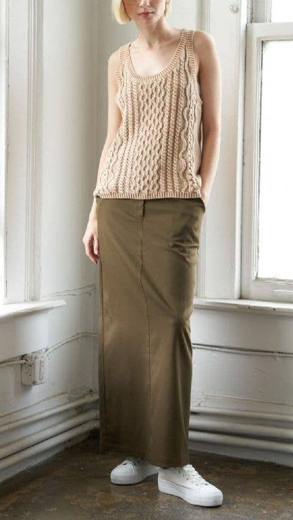 Washed camel colored cable knit tank top with U neckline and sleeveless cut.