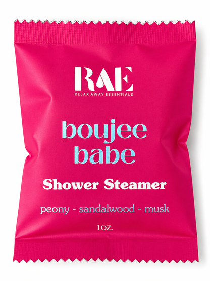 Pink shower steamer packaging with 'RAE' branding and product details on a white background