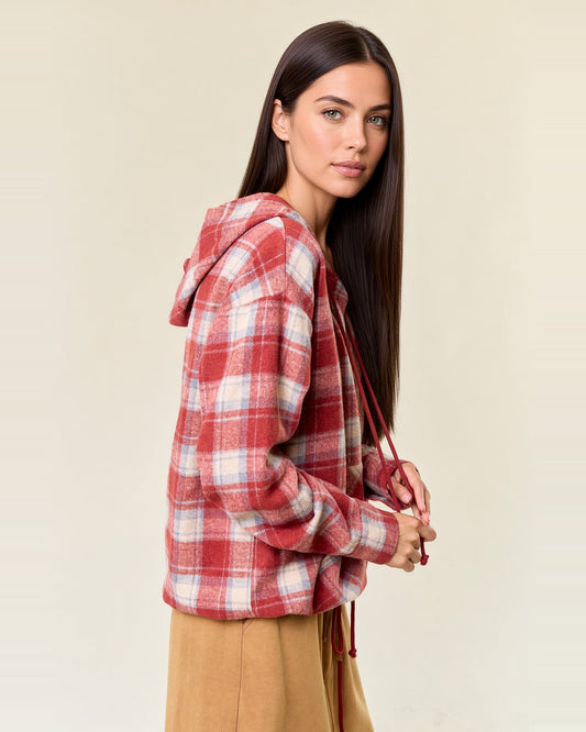 Side view of cranberry plaid flannel hoodie showing the attached hood, long sleeves and relaxed fit.