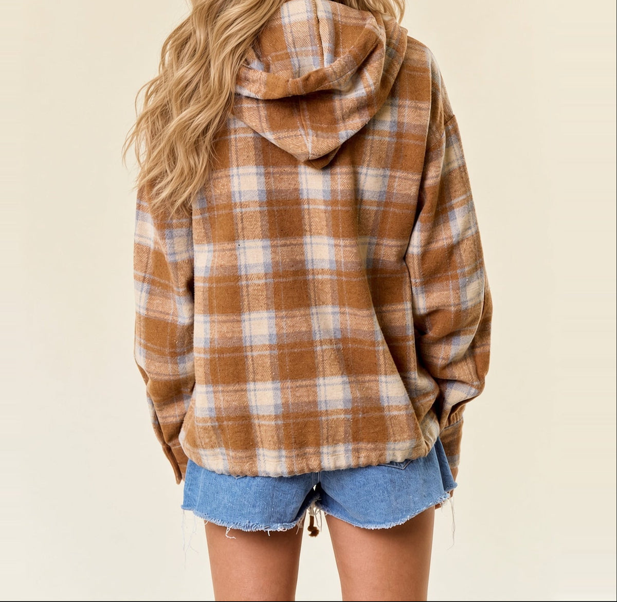 Close-up back view of acorn brown plaid flannel hoodie showing the attached hood and cream and light blue checks.