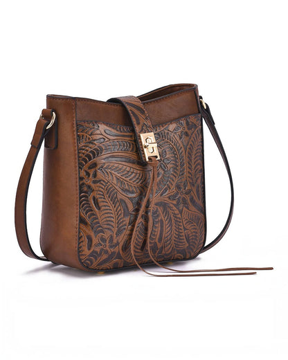 A brown leather shoulder bag with a tooled floral pattern on the front, featuring a gold-tone turn-lock closure and a long adjustable shoulder strap, shown on a white background.