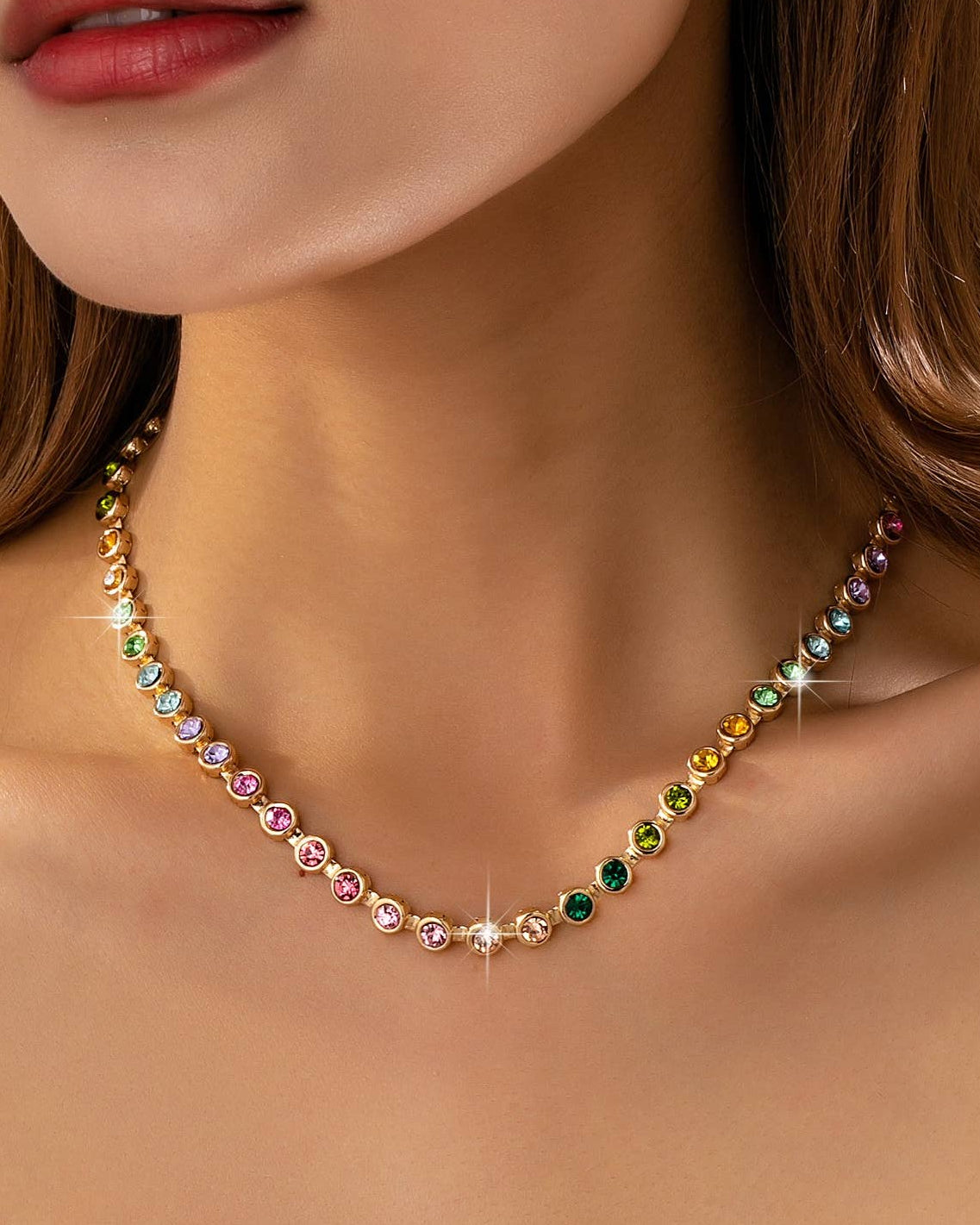 Multicolored beaded necklace worn by a model on a white background.