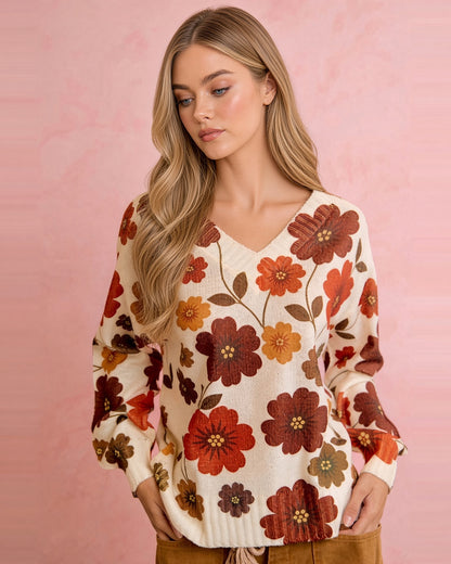 Front view of cream retro floral sweater showing V-neckline, relaxed fit, and ribbed cuffs and hem.