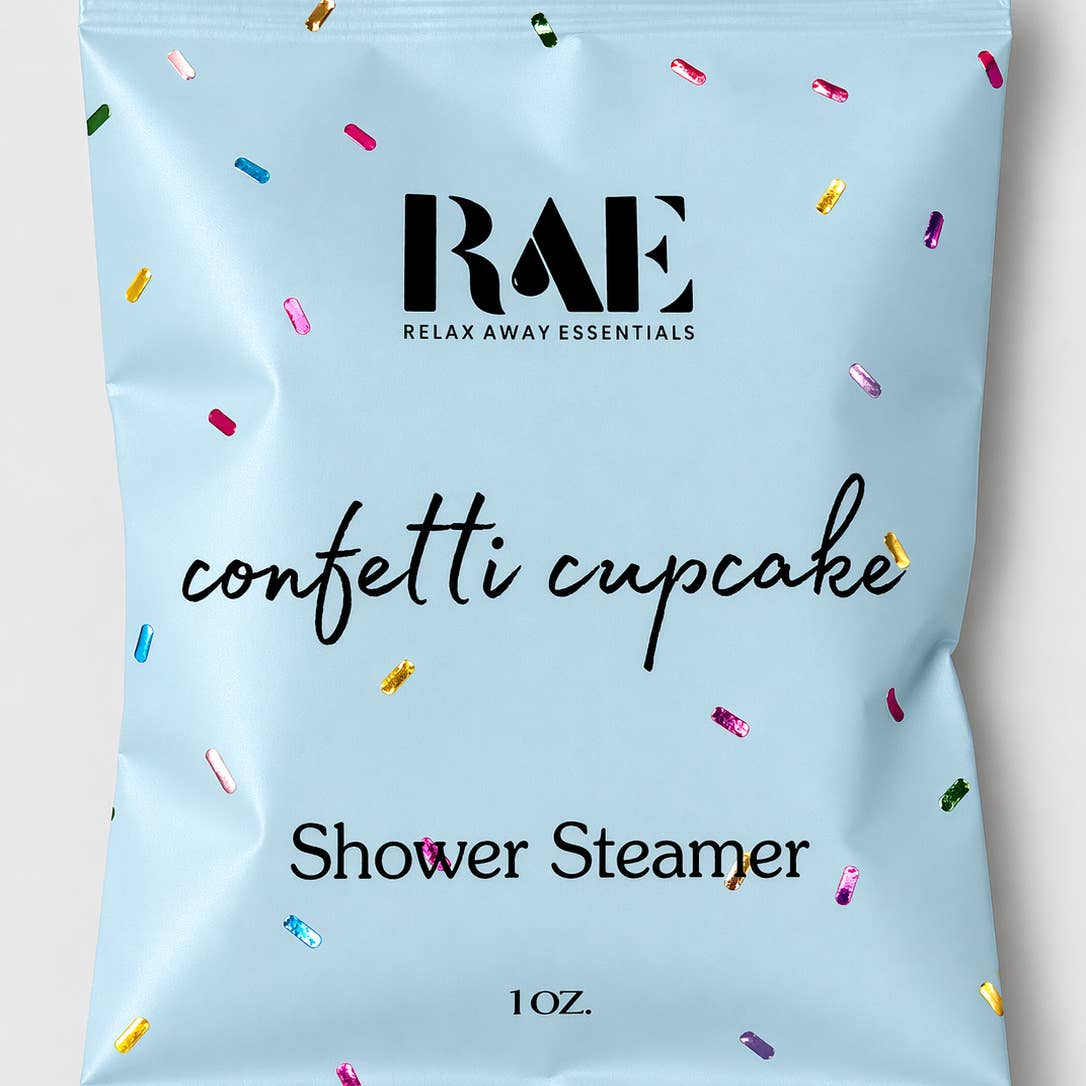 Shower steamer packaging with 'RAE' branding and confetti design on a light blue background.