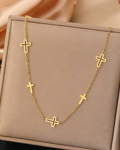 Gold dainty multi cross necklace.