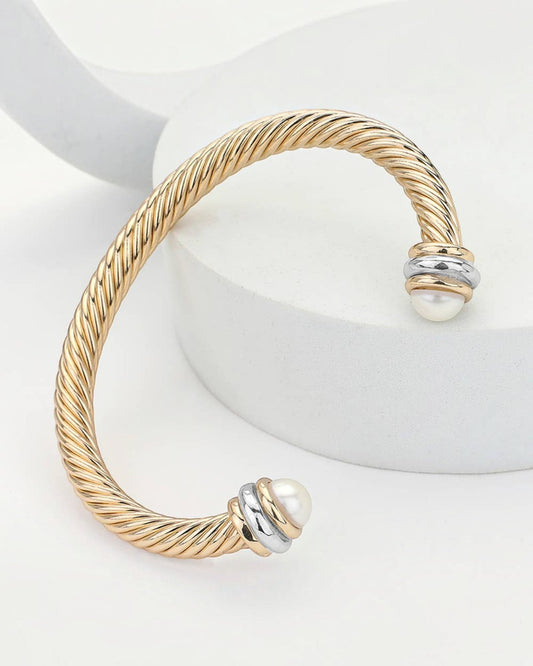 Gold rope open cuff bracelet with gold tips and silver accents.